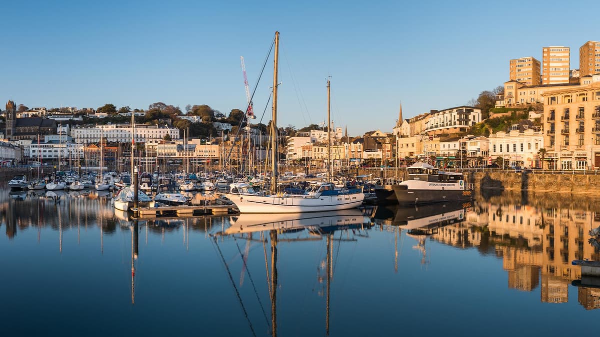 Torquay harbor with boats and buildings along the waterfront